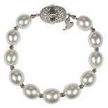 Henry Dunay, South Sea cultured pearl, diamond, platinum bracelet Composed of (11) oval shaped South