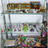 (Lot of approx. 50) Four shelves of assorted dolls, including Native American, South American,