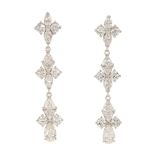 Pair of diamond, 18k white gold earrings Featuring (6) marquise, (12) full, (8) triangular and (2)
