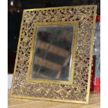 Bradley and Hubbard mirror, having a pierced foliate decorated frame, 16"h x 13.5"w