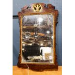 A Federal looking glass, having a mahogany molding centered with the giltwood carved medallion, 43"h