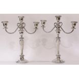 (lot of 2) A large Poole pair sterling weighted three light candelabra, each baluster form