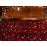 Louis XVI style marquetry decorated draw leaf table, having a highly figured rosewood top with