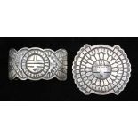 (lot of 2) A Southwest Darrin Bill (1965-2003) sterling silver lot: an oval buckle with a Hopi style