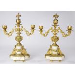 Pair of Louis XV style ormolu mounted candelabra, each having two lights, with scrolled arms,