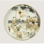 A Chinese enameled porcelain dish, painted with children at play, six character mark to the base,