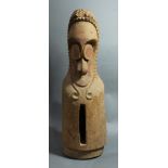 A Vanuatu small figural slit drum, A Namba people, Malekula, with oversized forehead and chip-Carved