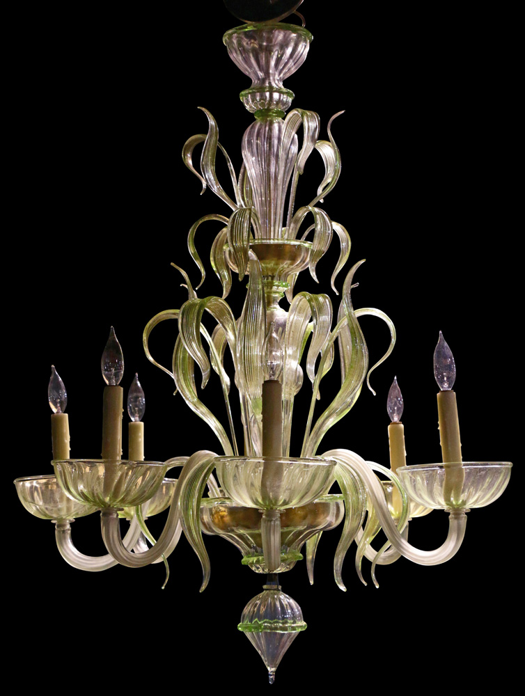 A Murano green to clear art glass chandelier, the seven light fixture with a tiered blown glass