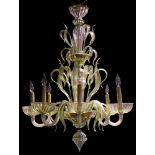 A Murano green to clear art glass chandelier, the seven light fixture with a tiered blown glass