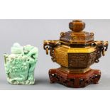 (Lot of 2) Two Chinese hardstone carvings, one a lidded censer with a pair of dragon handles, the