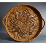 A Pacific Northwest American Indian Salish coiled basketry tray, early 20th Century, centering a