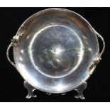 A Jensen style sterling tray, Woodside Sterling Co, the round dishform tray with twin leafy