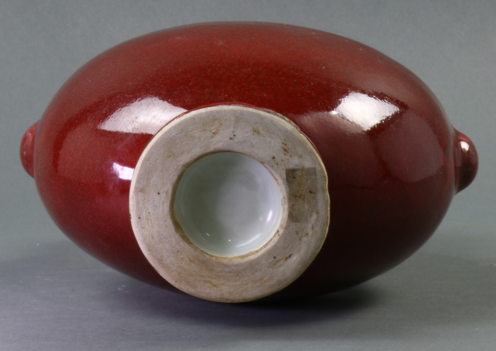 A Chinese copper red glazed porcelain moon-flask vase, of flattened circular shape raised on a low - Image 5 of 5