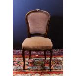 Louis XV style side chair, having a floral carved crest and rising on cabriole legs, 38"h