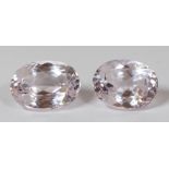 Pair of unmounted Kunzites Including (1) oval-cut kunzite, weighing 7.93 cts; together with (1)