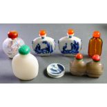 (Lot of 7) Seven Chinese snuff bottles, the first a pair of Chinese blue and white snuff bottles,