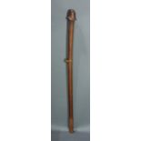 A Papua New Guinea fine and subtle pole club with phallic form head, having small sennit wrap, 37"h;