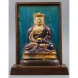 A Chinese molded porcelain seated buddha sculpture, with wood stand, size: 9"w x 11"h