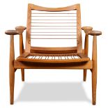 A Danish Modern Finn Juhl for John Stuart Model 133 teak armchair, having a shaped back, above