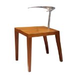 A Philipe Starck for Aleph "Royalton" chair, having a wishbone form aluminum back, above a cherry