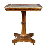 A Regency gilt bronze mounted mahogany tilt-top table, 19th century, having a mirrored top, and