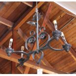 Spanish Revival hanging wrought iron chandelier, having four arms with scrolled accents, 28"h x 29"