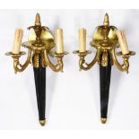 A pair of Neoclassical style gilt bronze mounted wall sconces, each having a pineapple finial