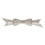 Diamond, platinum, and 10k white gold bow brooch Featuring (21) old-European-cut diamonds,