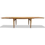 A Johannes Andersen for Uldum Mobelfabrik Danish Modern dining table, having a rectangular top,