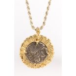 Silver coin form, yellow gold, silver pendant-necklace Featuring (1) silver coin form, measuring