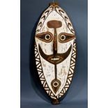 A decorative Papua New Guinea flat white panel with face