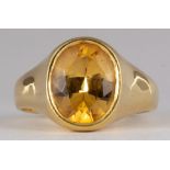 Topaz, 18k yellow gold ring Featuring (1) oval-cut topaz, weighing approximately 5.10 ct, set in