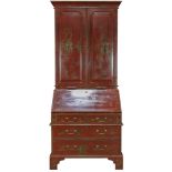 A George III style Chinoiserie red lacquered bureau bookcase, having a molded top, over panel