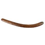An Australian Aboriginal carved boomerang, probably 19th C., old and much handled, 27"l; Provenance: