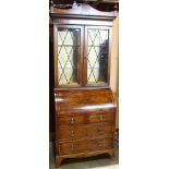 Federal style secretary bookcase, having two glass front doors above a leather tooled writing