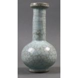 A Chinese guan style crackle bottle vase, of compressed globular shape and with long neck, the