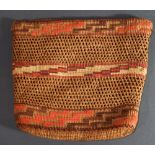 A Pacific Northwest American Indian Tlingit twined cedar root purse, having a wide rim narrowing