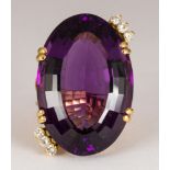 Amethyst, diamond, 18k yellow gold ring Featuring (1) oval-cut amethyst, weighing approximately 48.