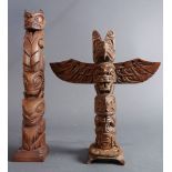 (lot of 2) A grouping of Pacific Northwest carved wood totem poles, 12.5"h
