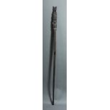 A Papua New Guinea double-figural staff, Massim People, nicely carved but dry, 42"h; Provenance: