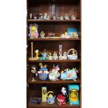 Five shelves of Looney Tunes collectibles, including Pepe Le Pew and Tweety Bird with Easter