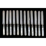 (set of 12) Victorian sterling mounted mother of pearl handled knives