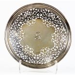 A Shreve & Co sterling tray, the dishform tray centering a floriform medallion with an engraved