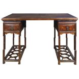 A Chinese hardwood writing desk, consisting of a detachable top supported by two pedestals with