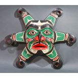 A Pacific Northwest Coast Kwakiutl cedar wood sun mask, 20th Century, Bella Coola region, having