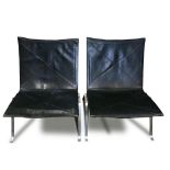 Pair of Mid-Century Modern black leather lounge chairs, each having a seat and back with "X" form