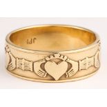 9k yellow gold ring The 9k Claddagh band, measuring approximately 7.3 mm in width, (marked JPK,