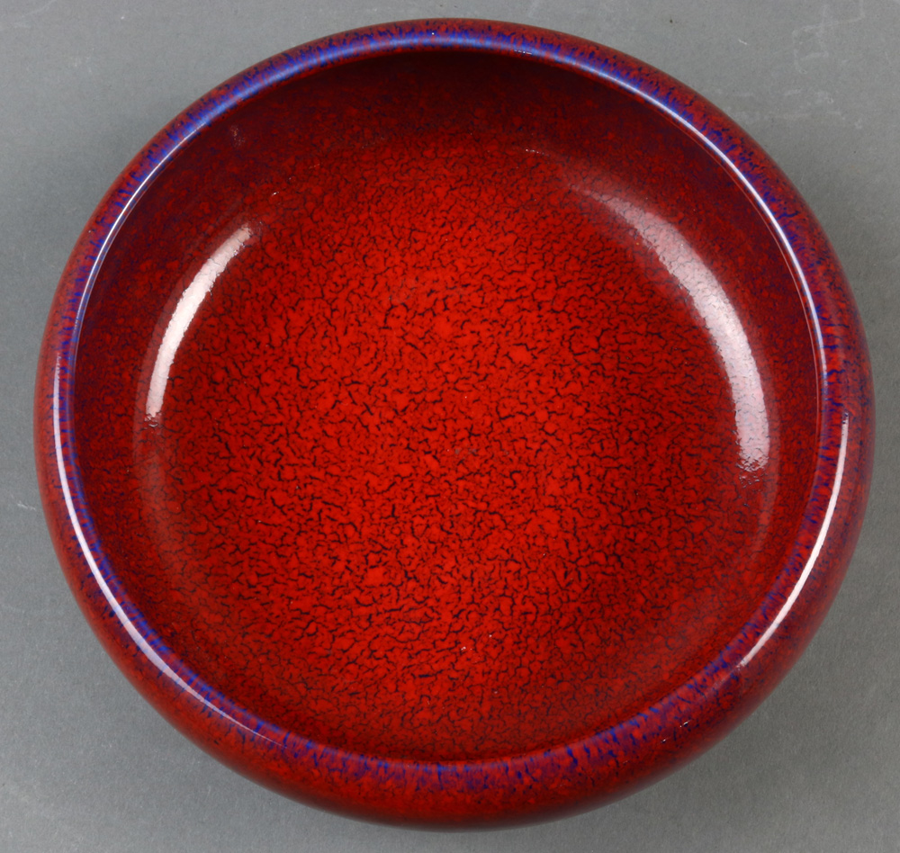 A Chinese copper red ceramic bowl, with recessed base and overall applied purple flare, size: 8"w