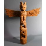 A Pacific Northwest Coast Kwakiutl cedar totem pole, 20th Century, depicting a raven and turtle, the