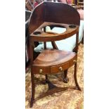 Regency mahogany wash basin, having a band inlaid case with three drawers, and rising on outswept